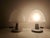 Pair of diffused light lamps. Transparent pressed glass diffuser with a satin finish. Transparent plastic base with a...