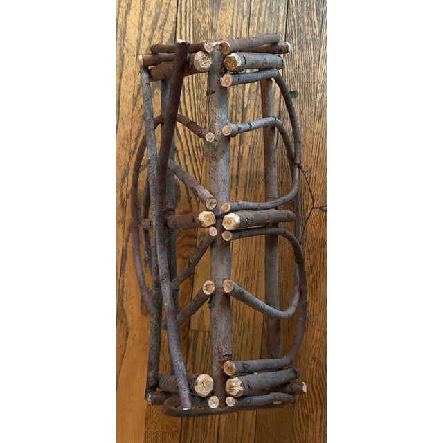 Vintage wall mount Adirondack style handmade twig magazine holder. 22" long, 11" wide, 14.5" tall. Has wire on back to...