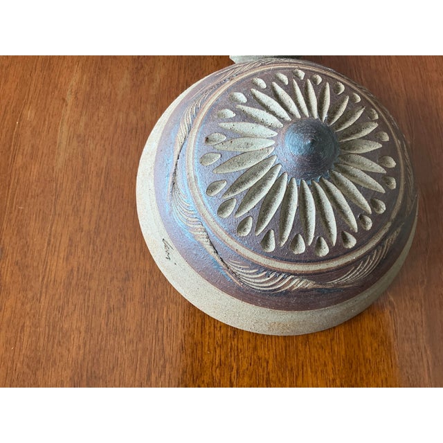 ThisMCM Southwestern earthenware pottery is an authentic piece signed by the artist. This lovely pottery piece features a...