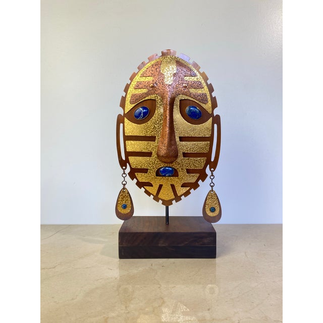 Vintage mixed-media tribal mask sculpture signed by Chilean artisan Christian Luis Gómez, hand-hammered and textured brass...