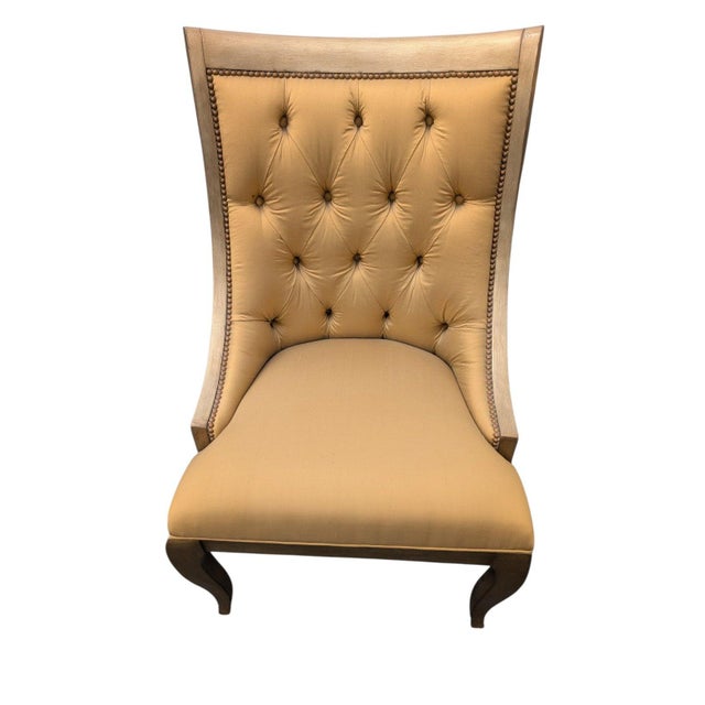 A set of six custom upholstered dining chairs by Marge Carson, the high-end California maker. Each chair's manufacturer...