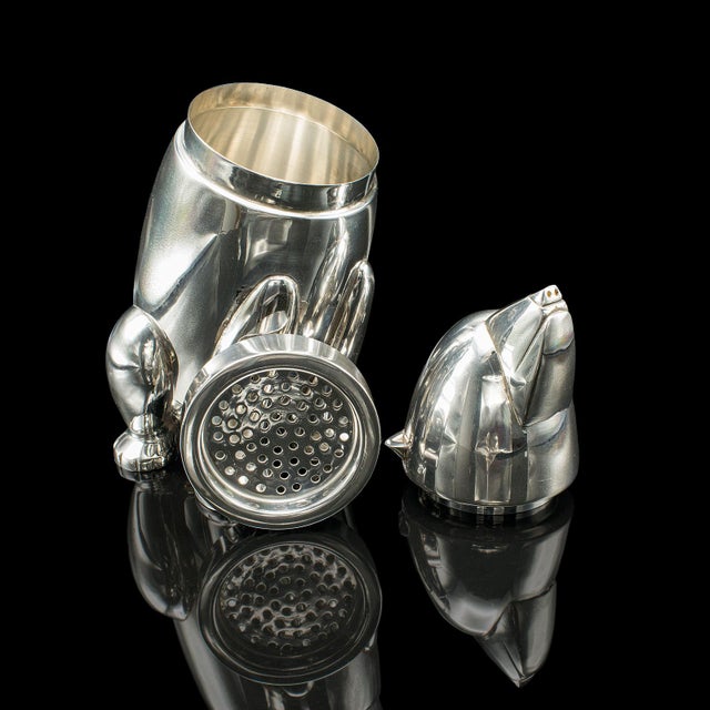 This is a vintage polar bear cocktail shaker. An American, silver plated barware mixer, dating to the Art Deco period,...