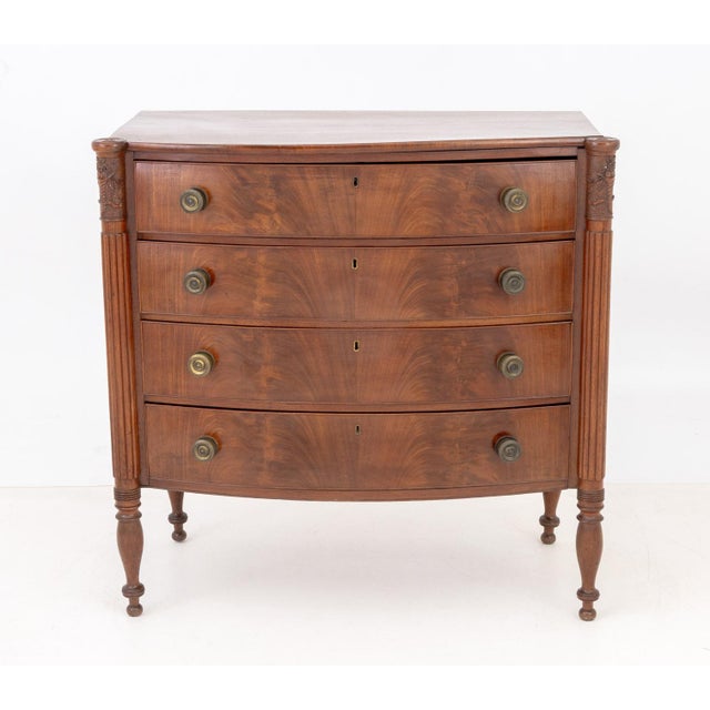 Samuel McIntrye Style Flame Mahogany Bowfront &nbsp;Chest of Drawers, with carved spiral and floral motif fluted columns...