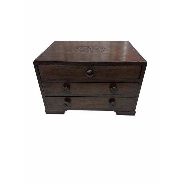 Vintage chinoiserie three drawer storage box. The finish is dark brown. Overall measures 12.5” w x 9” d x 8” h. Each...