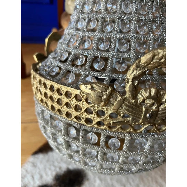 Up for consideration is a beautiful pair of 1970s peekaboo medium size chandeliers. These would look lovely in your home...