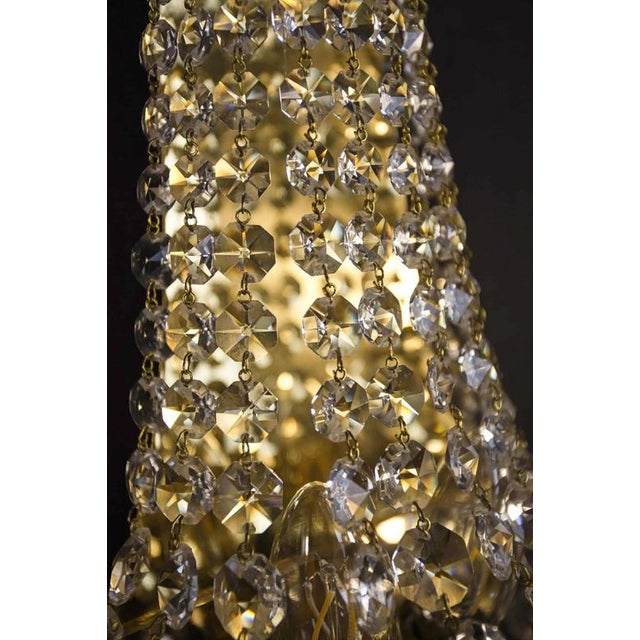 Pair of wall lamps with crystals pair of wall lamps made of polished brass with crystal trimmings that will brighten up...