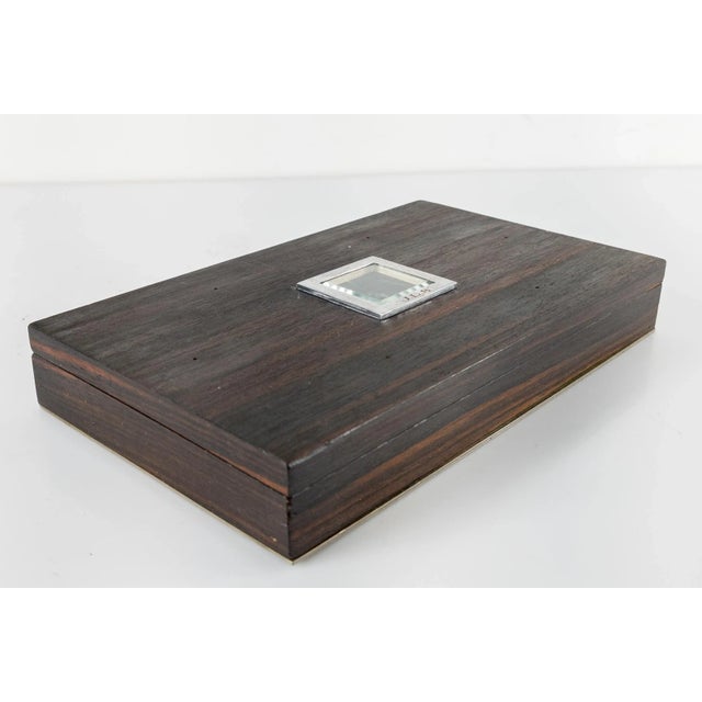 We are selling this cool and stylish small rosewood box. The Mid-Century Madmen style box has very fine rosewood veneer...
