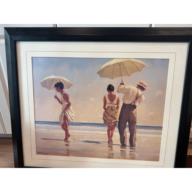 This popular contemporary piece depicts a nostalgic coastal scene with figures holding a parasols on a beach. Fine Artwork...