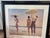 This popular contemporary piece depicts a nostalgic coastal scene with figures holding a parasols on a beach. Fine Artwork...