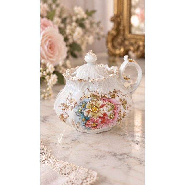 In early-20th-century Japanese export porcelain petite sugar bowl or condiment pot featuring a highly decorative molded...