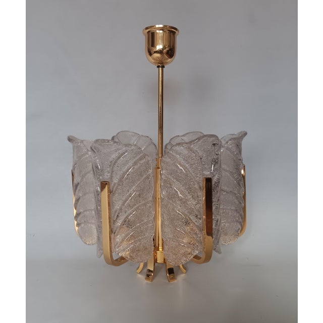 Scandinavian Glass and Gilt Metal Chandelier by Carl Fagerlund for Orrefors, Sweden, 1970s, in Very Good conditions....