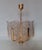 Scandinavian Glass and Gilt Metal Chandelier by Carl Fagerlund for Orrefors, Sweden, 1970s, in Very Good conditions....