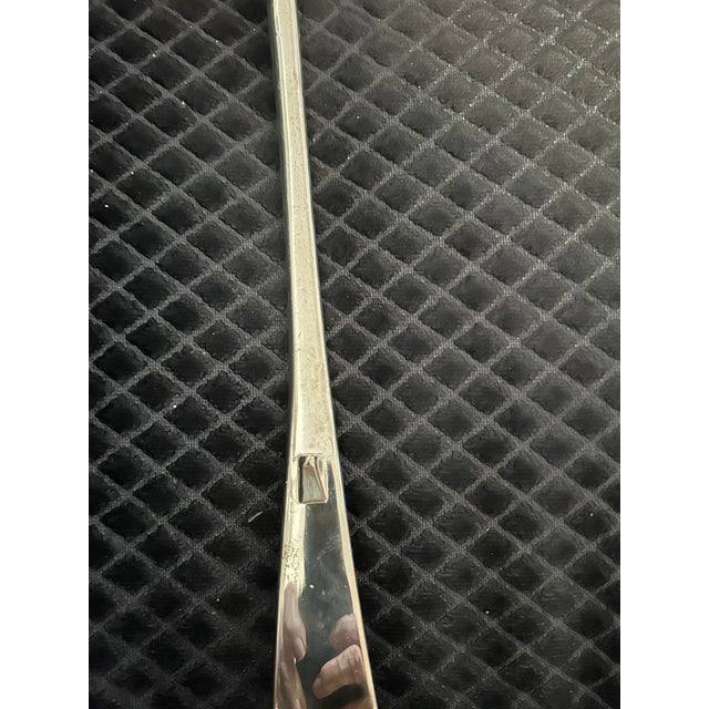 Vintage silver-plated soup or punch ladle with a curved handle and a deep, rounded bowl, mid-20th-century Georgian-style...