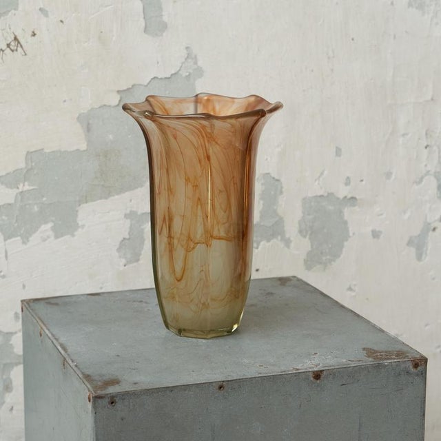 Mid Century Wavy Orange Art Glass Vase 1970s. This is a beautiful slender art glass vase with a wavy and sculptural...