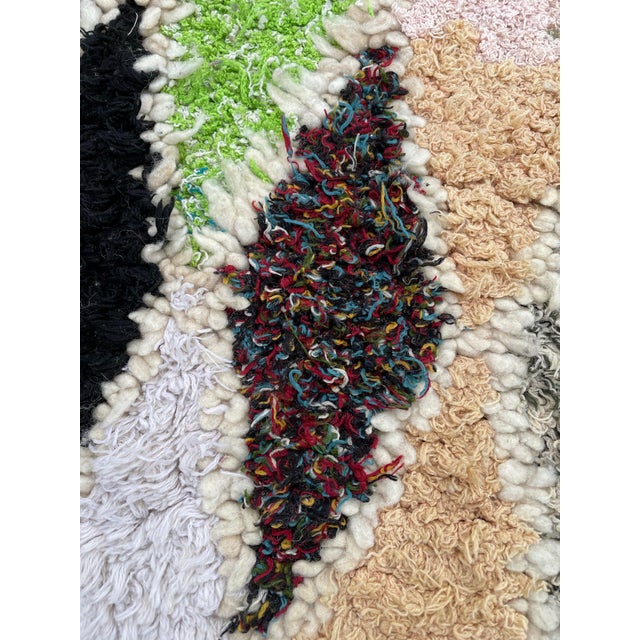 Hand-woven by the Berber women in the Atlas Mountains, this Vintage rug is created with soft natural wool fibers from the...