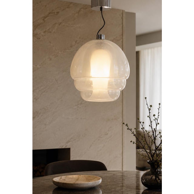 A striking Medusa pendant lamp by Carlo Nason for A.V. Mazzega, featuring a sculptural layered glass form that gives the...