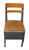 Vintage child's school chair with a steel structure and wooden seat and back. The fully enclosed lower area functions as a...