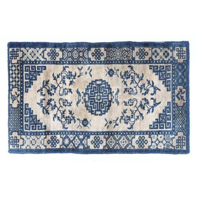 Antique Chinese Peking Rug with Longevity Symbols in Indigo & Warm Ivory This elegant antique Chinese Peking rug showcases...