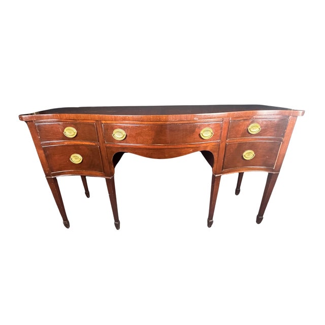 An elegant vintage credenza in the Federal and Hepplewhite tradition, featuring the refined proportions, graceful lines,...