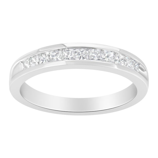 Elegant and timeless, this diamond wedding band features 1/2 carat total weight of diamonds with an astonishing eleven...