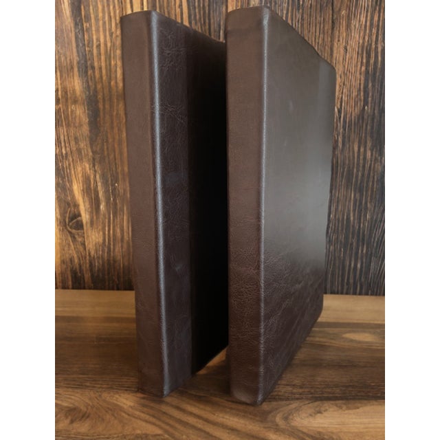 Capture your thoughts and inspiration in style with this handsome set of two faux leather brown journals. Featuring a...