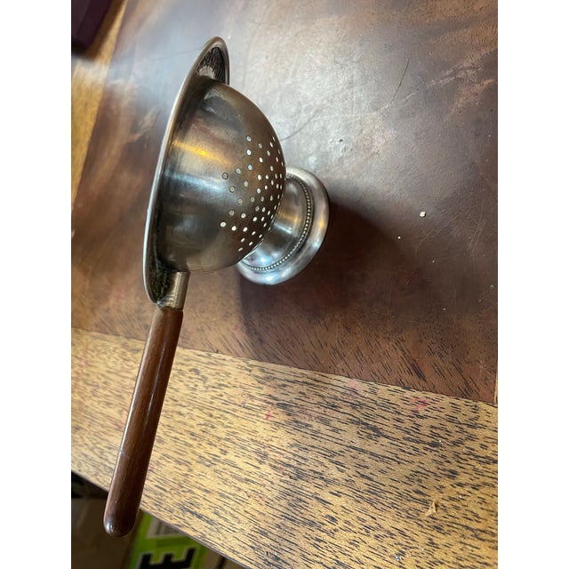 This piece is made of Alpaca which is a type of metal that looks like silver, I have never seen a tea strainer like this...