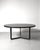 Black round Tecno table with black lacquered top and chromed sculptural legs This piece is attributed to the mentioned...