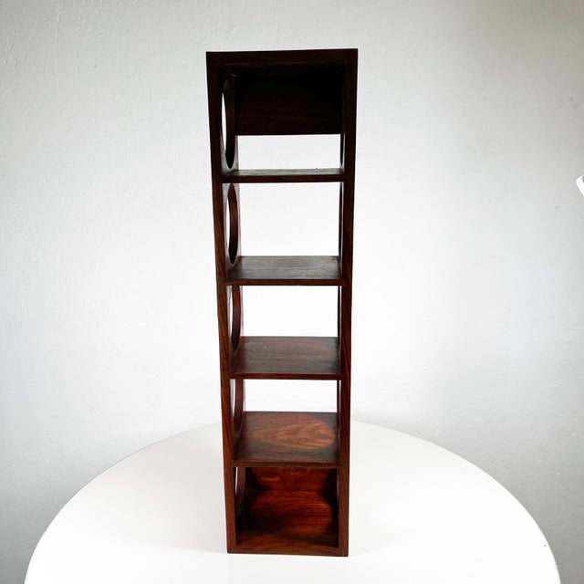 AMBIANIC presents Modern Rosewood 5 Bottle Wine Holder Stand in Exotic Wood By Crate & Barrel. Appears as exotic wood....