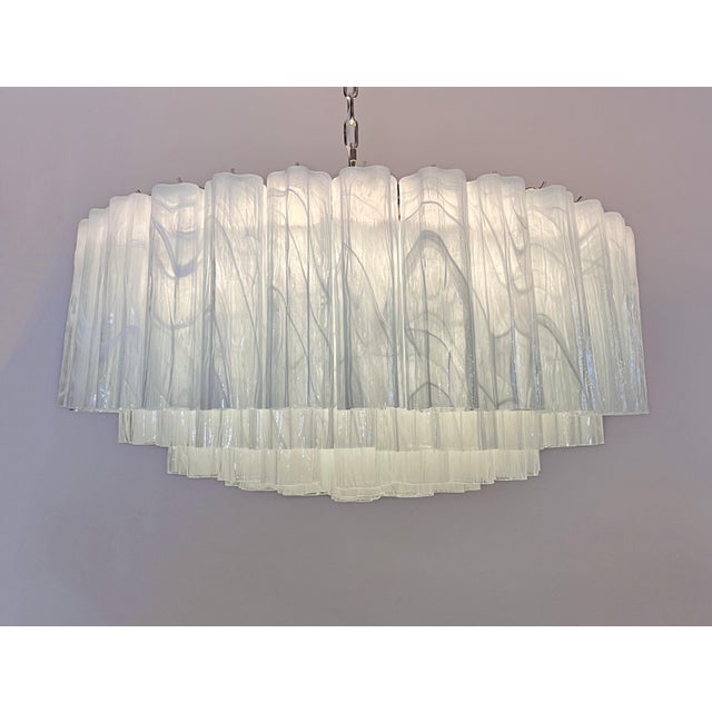 Italian vintage chandelier in Murano glass and nickel plated metal structure. The armor polished nickel supports 101 large...