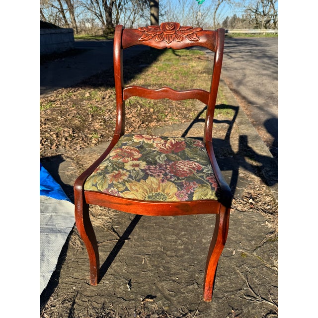 Hand carved rose back mahogany side chair from the late 19th to early 20th century. Beautiful tapestry-like floral...