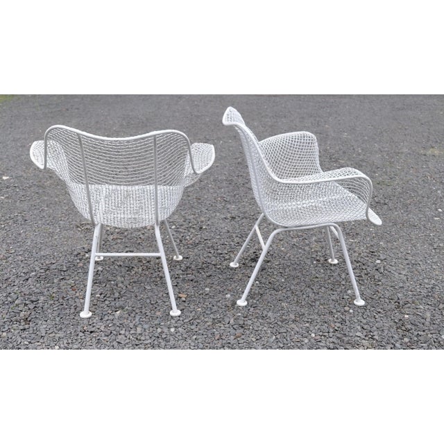 Woodard Sculptura Armchairs a Pair. They are 27" wide x 24" deep and the back height is 27.25". Seat height is 14". Good...