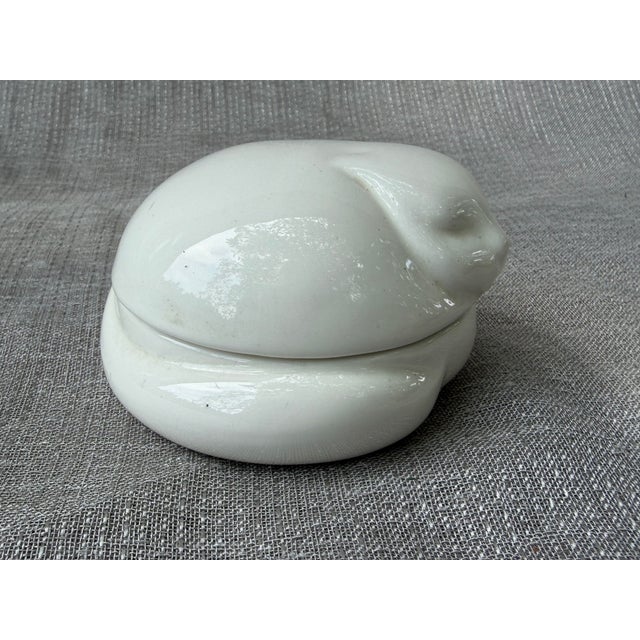 Vintage 1977 white porcelain sleeping cat trinket box by Tiffany & Co. Glossy porcelain finish. Underside carries the...