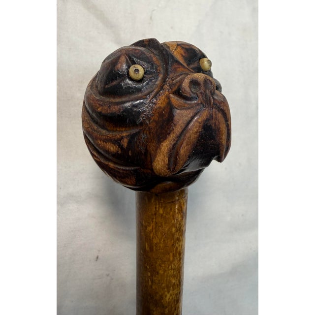 This antique 19th century hand carved Folk Art bulldog walking stick cane is a unique and original piece of antique décor....
