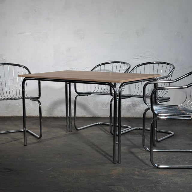 This set of four cantilever dining chairs is designed in the spirit of Gastone Rinaldi, the celebrated Italian designer...