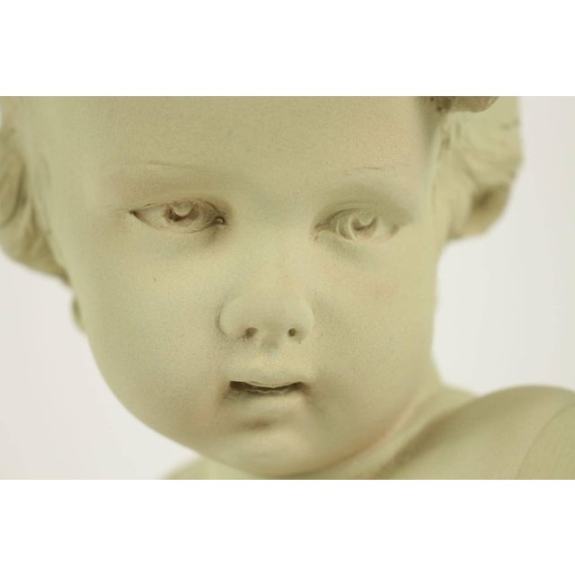 Bust of a child in terra cotta from the 20th century. Signed Gobet.