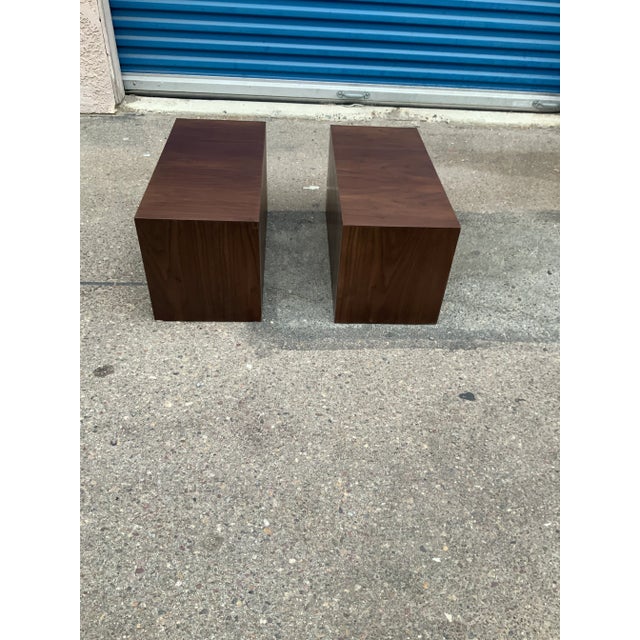 Modern walnut low profile end tables. The tables are open on one end and closed on other. The tables are alder with walnut...