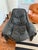 A sculptural and exceptionally comfortable black leather lounge chair by IMG Norway. Featuring a distinctive sling-style...