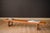 Mid Century Modern low coffee table bench designed by Torbjørn Afdal for Bruksbo, Norway. Features rich teak grains and...