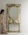 This piece presents as a cabinet, distinguished by whitewashed carved wood, scroll motif. Dating to Early 19th Century and...