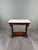 An elegant french console table in the napoleon iii style, dating from the second half of the 19th century, crafted from...