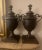 Pair of very handsome, heavy solid bronze handled urns with removable lids. Height overall is 16” including lids, width at...
