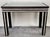 A chic and timeless Mid-Century Modern console or table with matching mirror in a geometric style featuring white and...