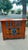 Antique Chinese Qing Dynasty cabinet, crafted from elm wood, and finished in a distressed lacquered orange It features two...