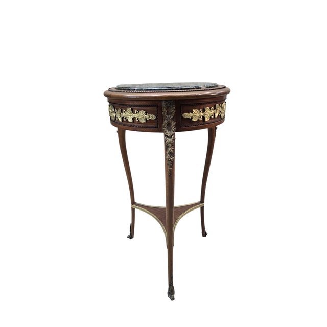 Vintage French Louis XVI Style Marble Top Gueridon Side Table with Gilt Bronze Mounts An elegant vintage French Louis XVI...