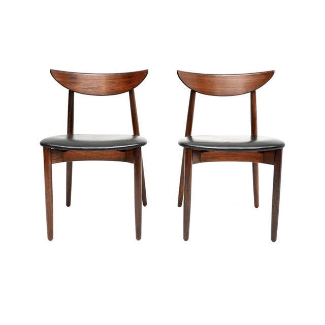 An exceptionally beautiful pair of Danish vintage dining chairs by Harry Ostergaard for Randers. They were made in Denmark...
