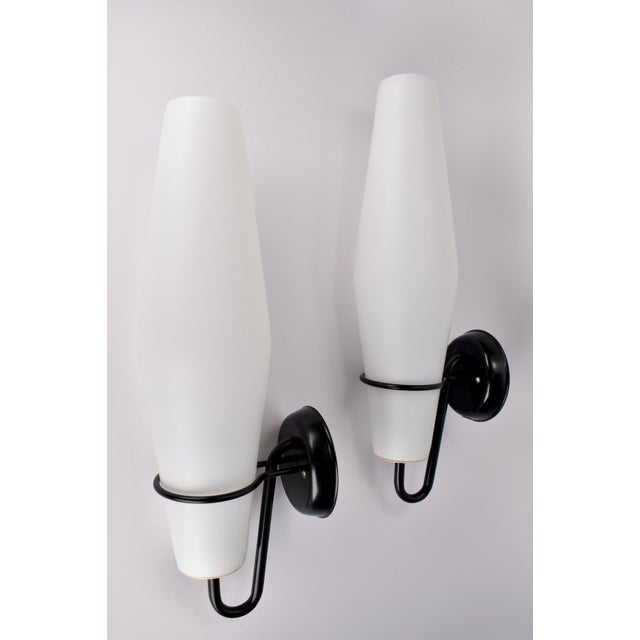 Bring timeless mid-century style into your home with this set of two modernist RAAK wall sconces. Designed in 1958 by the...