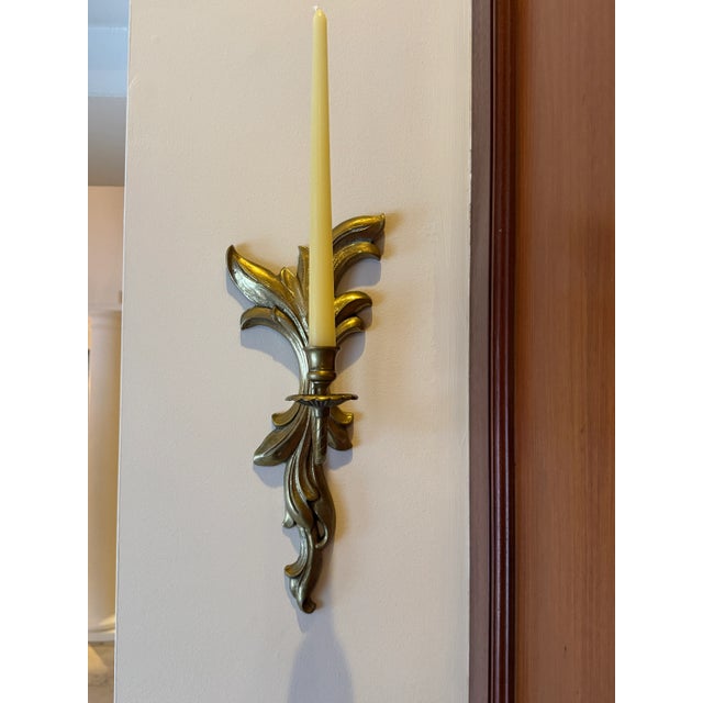 A pair of heavy, solid brass candle sconces. These are a well-made vintage set - circa 1920’s. One sconce is approx. 5.5"...