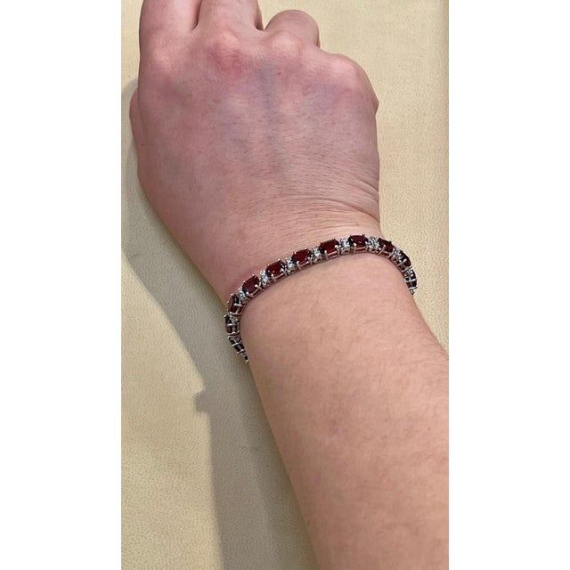 This exceptionally affordable Tennis bracelet has 19 stones of oval shape Garnet Beautiful colors , very Vibrant Size of...