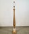1960's Hollywood Regency Italian column floor lamp for sale. It's made of solid fluted wood, and has a solid travertine...