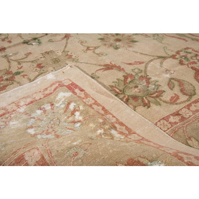 Beautiful Persian Distressed Tabriz hand-knotted wool rug with the taupe field. This Tabriz rug has patterns consisting of...